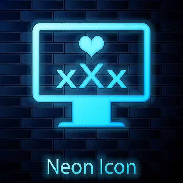 Glowing neon Computer monitor with 18 plus content heart icon isolated on brick wall background. Age restriction symbol. XXX content sign. Adult channel. Vector Illustration — Stock Vector