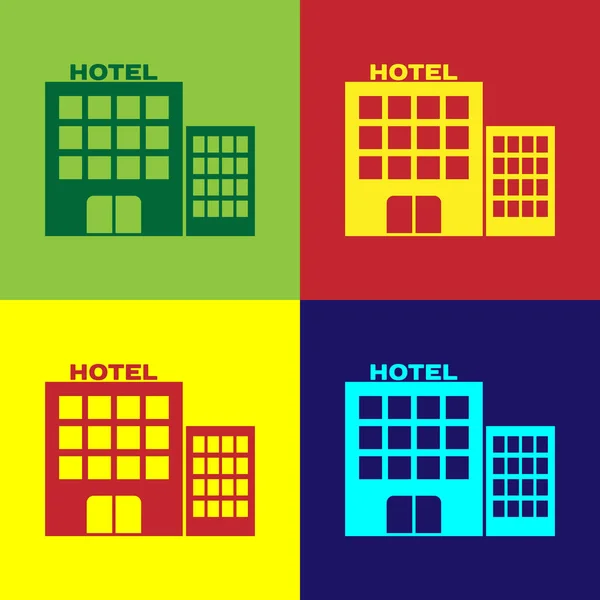 Ikona budovy barevného hotelu je izolovaná na barevném pozadí. Vektorová ilustrace — Stockový vektor
