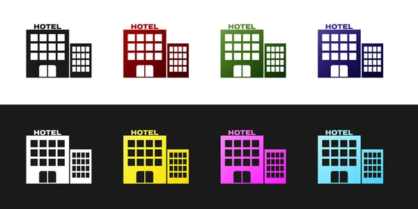 Defina o ícone do edifício do hotel isolado no fundo preto e branco. Ilustração vetorial — Vetor de Stock