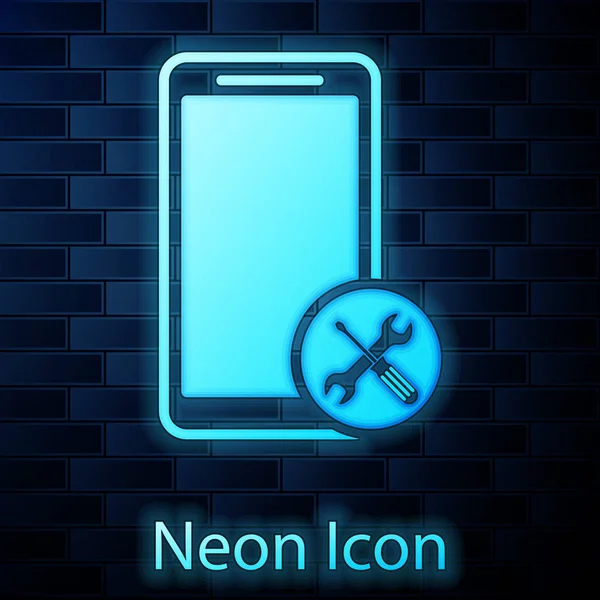 Leuchtende Neon-Smartphone mit Schraubenzieher und Schraubenschlüssel-Symbol isoliert auf Backstein-Wand-Hintergrund. Anpassung, Service, Einstellung, Wartung, Reparatur, Reparatur. Vektorillustration — Stockvektor