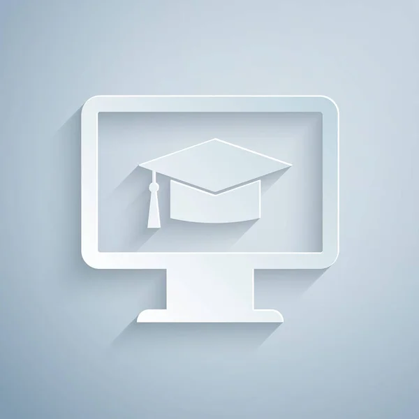 Kağıt kesme Bilgisayar monitörü, gri arka planda izole mezuniyet kapağı simgesiyle. Online öğrenme veya e-öğrenme kavramı. İnternet bilgi sembolü. Kağıt sanat tarzı. Vektör İllüstrasyonu — Stok Vektör