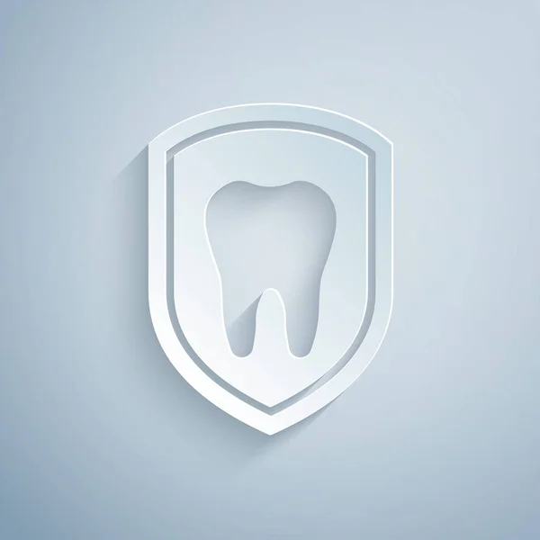 Paper cut Dental protection icon isolated on grey background. Tooth on shield logo icon. Paper art style. Vector Illustration — Stock Vector
