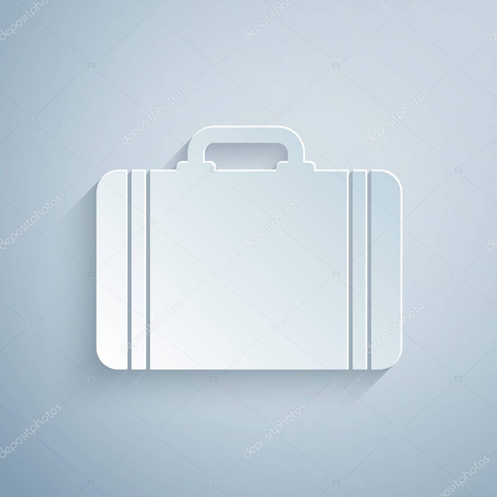 Paper cut Suitcase for travel icon isolated on grey background. Traveling baggage sign. Travel luggage icon. Paper art style. Vector Illustration