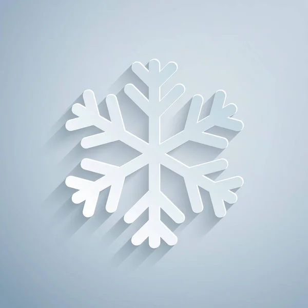 Ikona sněhové vločky je izolovaná na šedém pozadí. Styl papírového umění. Vektorová ilustrace — Stockový vektor