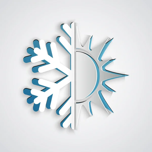 Corte de papel Símbolo frío y caliente. Icono de sol y copo de nieve aislado sobre fondo gris. Símbolo de invierno y verano. Estilo de arte de papel. Ilustración vectorial — Vector de stock