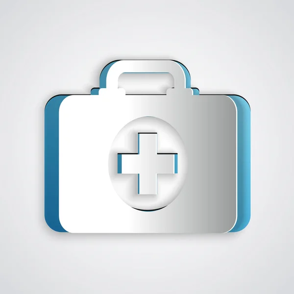 Paper cut First aid kit icon isolated on grey background. Medical box with cross. Medical equipment for emergency. Healthcare concept. Paper art style. Vector Illustration — Stock Vector