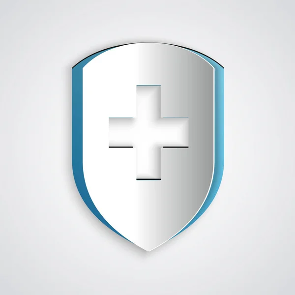 Corte de papel Escudo médico con icono de cruz aislado sobre fondo gris. Protección, seguridad, seguridad con contraseña. Estilo de arte de papel. Ilustración vectorial — Archivo Imágenes Vectoriales