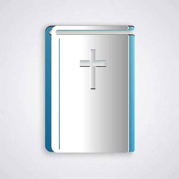 Carta tagliata icona del libro della Sacra Bibbia isolato su sfondo grigio. Stile cartaceo. Illustrazione vettoriale — Vettoriale Stock