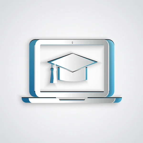 Paper cut Graduation cap on screen laptop icon isolated on grey background. Online learning or e-learning concept. Paper art style. Vector Illustration — Stock Vector
