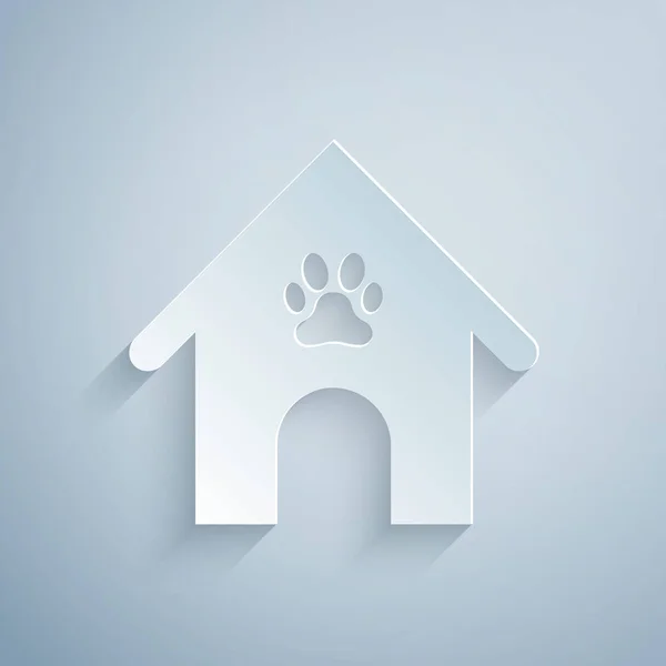 Kağıt kesilmiş Köpek ev ve pençe baskı pet simgesi gri arka plan üzerinde izole. Köpek kulübesi. Kağıt sanat tarzı. Vektör İllüstrasyonu — Stok Vektör