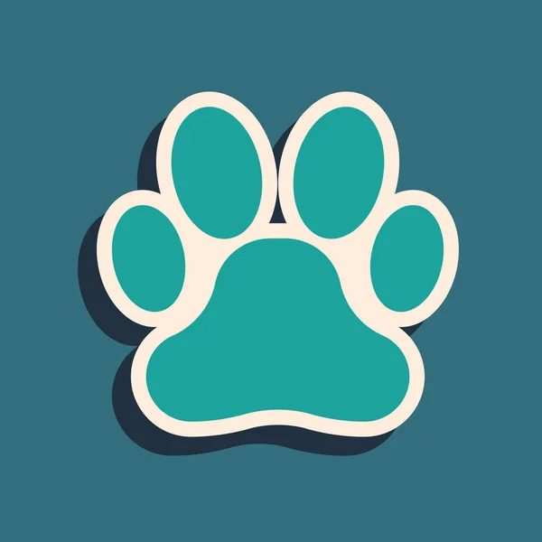Grünes Pfotendrucksymbol isoliert auf blauem Hintergrund. Pfotenabdruck für Hund oder Katze. Tierspur. Lange Schatten. Vektorillustration — Stockvektor