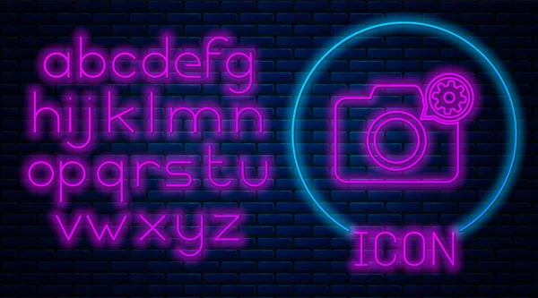 Glowing neon Photo camera and gear icon isolated on brick wall background. Adjusting app, service concept, setting options, maintenance, repair, fixing. Neon light alphabet. Vector Illustration — Stock Vector