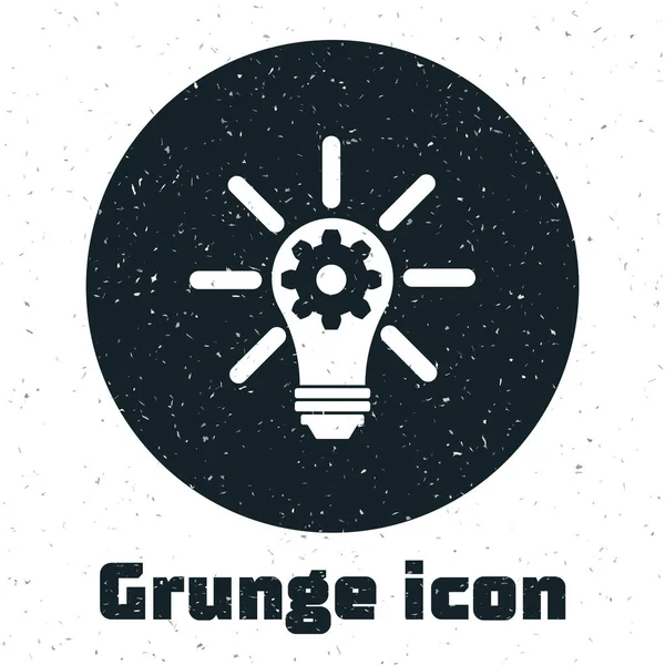 Grunge-Glühbirne mit Strahlen Glanz und Ausrüstung im Inneren Symbol isoliert auf weißem Hintergrund. Innovationskonzept. Vektorillustration — Stockvektor