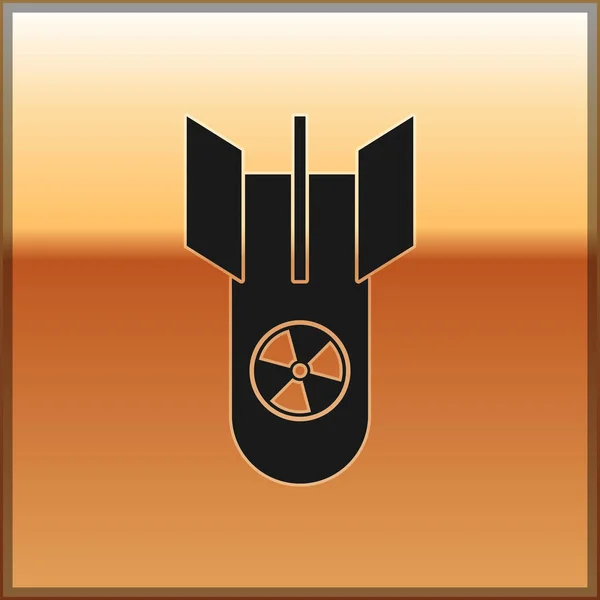 Icona bomba nucleare nera isolata su sfondo oro. La bomba a razzo vola giù. Illustrazione vettoriale — Vettoriale Stock