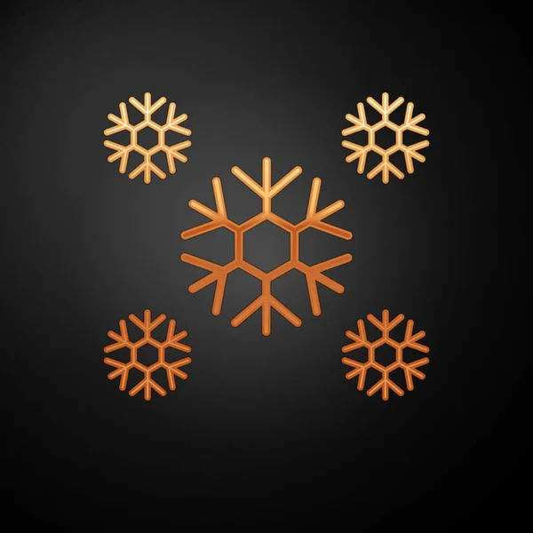 Goldenes Schnee-Symbol isoliert auf schwarzem Hintergrund. Vektorillustration — Stockvektor