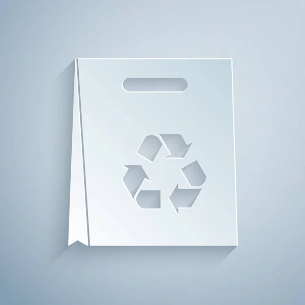 Papiergeschnittene Einkaufstasche aus Papier mit Recycling-Symbol isoliert auf grauem Hintergrund. Tasche mit Recycling-Symbol. Papierkunst. Vektorillustration — Stockvektor