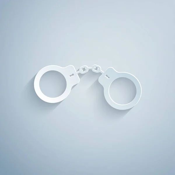 Paper cut Handcuffs icon isolated on grey background. Paper art style. Vector Illustration — Stock Vector