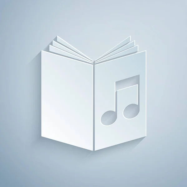 Pappersklipp ljud boks ikonen isolerad på grå bakgrund. Musikalisk anteckning med bok. Ljudguide tecken. Online läro koncept. Papperskonst stil. Vektor illustration — Stock vektor