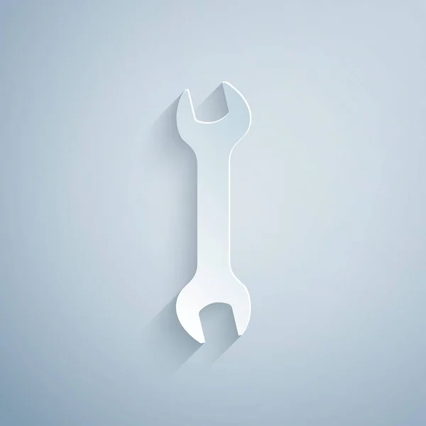 Паперовий виріз значок ключа ізольовано на сірому фоні. Інструмент для ремонту ключів. Символ інструменту обслуговування. Стиль паперового мистецтва. Векторна ілюстрація — стоковий вектор