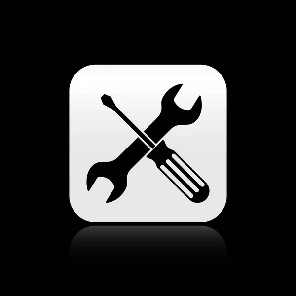 Black Crossed screwdriver and wrench tools icon isolated on black background. Service tool symbol. Silver square button. Vector Illustration — Stock Vector