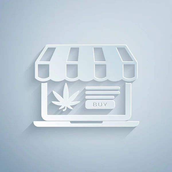 Kağıt kesiği Laptop ve tıbbi marihuana veya gri arka planda izole edilmiş kenevir yaprağı ikonu. İnternetten satın alma sembolü. Süpermarket sepeti. Kağıt sanatı tarzı. Vektör İllüstrasyonu — Stok Vektör