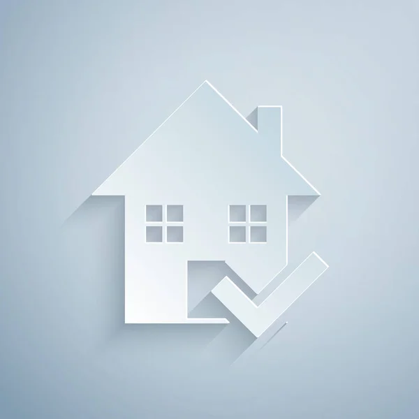 Corte de papel Casa con icono de marca de verificación aislado sobre fondo gris. Agencia inmobiliaria o casa de campo clase elite ciudad. Estilo de arte de papel. Ilustración vectorial — Vector de stock