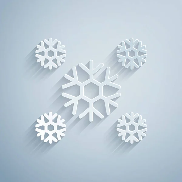 Papel cortado ícone de neve isolado no fundo cinza. Estilo de arte de papel. Ilustração vetorial — Vetor de Stock