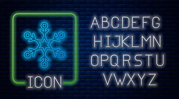 Leuchtende neonfarbene Schneeflocke Ikone isoliert auf Backsteinwand Hintergrund. Neonlicht-Alphabet. Vektorillustration — Stockvektor