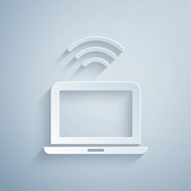 Kağıt kesiği kablosuz dizüstü bilgisayar simgesi gri arkaplanda izole edildi. İnternet kavramının kablosuz bağlantısı. Kağıt sanatı tarzı. Vektör.