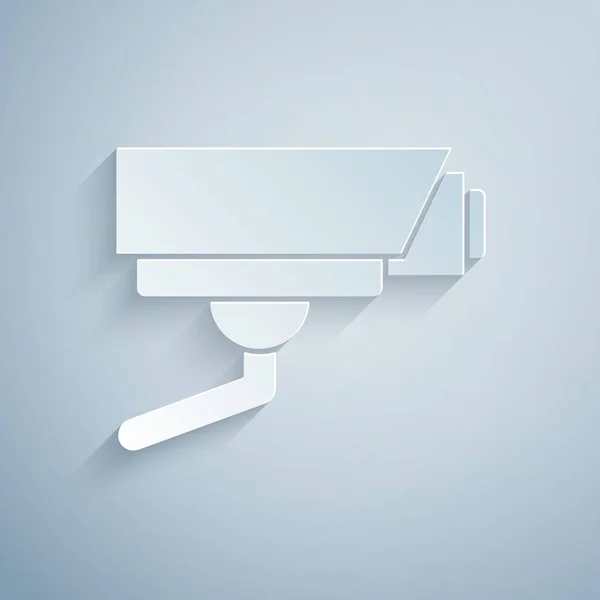 ペーパーカットグレーの背景に隔離されたセキュリティカメラアイコン 紙のアートスタイル ベクトル — ストックベクタ