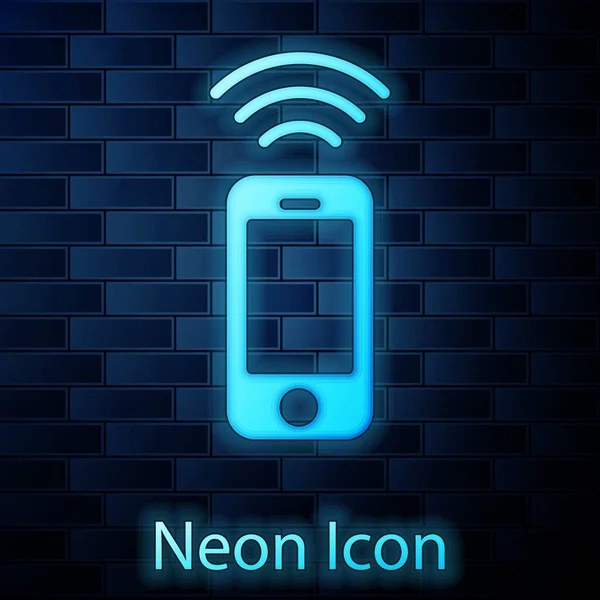 Glowing neon Wireless smartphone 아이콘 벽돌 벽 배경에 분리. Vector — 스톡 벡터