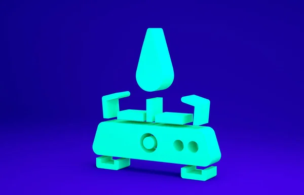 Зеленый значок газовой плиты выделен на синем фоне. Портативная газовая горелка. Пешие прогулки, кемпинг. Концепция минимализма. 3D-рендеринг — стоковое фото