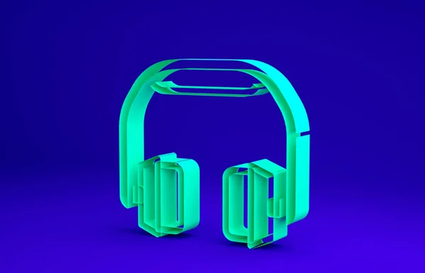 Icono de auriculares verdes aislado sobre fondo azul. Auriculares. Concepto para escuchar música, servicio, comunicación y operador. Concepto minimalista. 3D ilustración 3D render —  Fotos de Stock