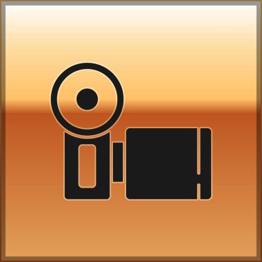 Siyah Sinema kamera ikonu altın arka planda izole edildi. Video kamera. Film tabelası. Film projektörü. Vektör.