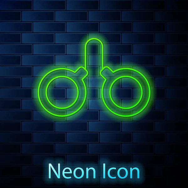 Glowing Neon Line Handcuffs Icon Isolated Brick Wall Background Vector — Stock Vector