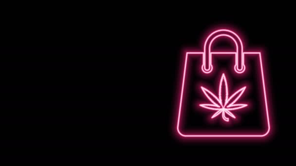 Glowing neon line Shopping paper bag of medical marijuana or cannabis leaf icon isolated on black background. Membeli ganja. Simbol Hemp. Animasi grafis gerak Video 4K — Stok Video