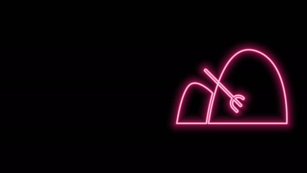 Gloeiende neon lijn Baal van hooi en hark pictogram geïsoleerd op zwarte achtergrond. 4K Video motion grafische animatie — Stockvideo