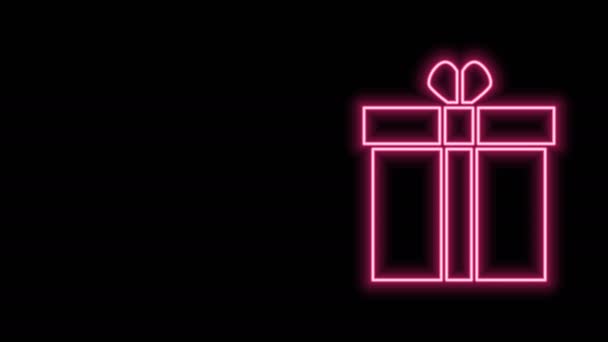 Leuchtende Neon-Linie Geschenkbox und Herz-Symbol isoliert auf schwarzem Hintergrund. Valentinstag. 4K Video Motion Grafik Animation — Stockvideo