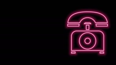 Parlayan neon hattı telefon ikonu siyah arkaplanda izole edildi. Sabit telefon. 4K Video hareketli grafik canlandırması