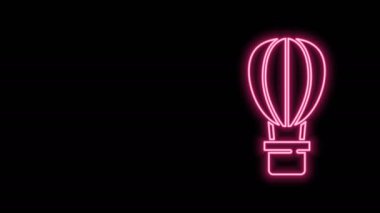 Parlayan neon hattı Sıcak hava balonu simgesi siyah arkaplanda izole edildi. Seyahat için hava taşımacılığı. 4K Video hareketli grafik canlandırması