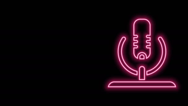 Glowing neon line Microphone icon isolated on black background. On air radio mic microphone. Speaker sign. 4K Video motion graphic animation — Stock Video