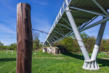 Remains of former border called from Cold War perdiod in Devinska Nova Ves, Bratislava - view with Freedom Cycling Bridge clipart