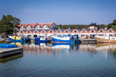 Dziwnow, Poland - June 26, 2019: Port of Dziwnow town in north western Poland situated on the Baltic Sea coast clipart