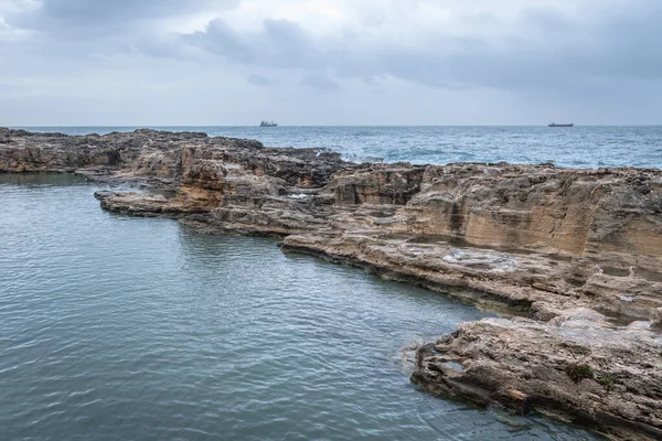 Sea wall in historic Batroun city on the Mediterranean Sea coast in Batroun District, Lebanon