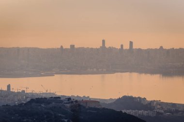 Sunset over Beirut city on the Mediterranean coast, capital of Lebanon - view from Our Lady of Lebanon shrine in Harissa