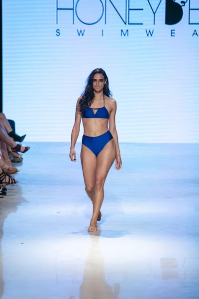 A model walks the runway for Honey Bee Swim Summer collection 2018 fashion show during Art Hearts Fashion Swim 2019 in Miami Beach at the Faena Forum on July 13th