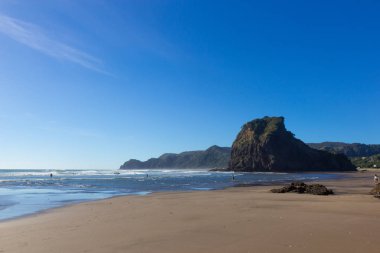 view of sunny Piha beach, New Zealand clipart