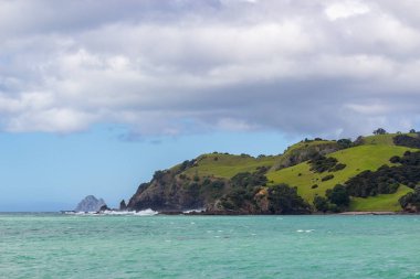 view from boat of Bay of Islands, New Zealand clipart