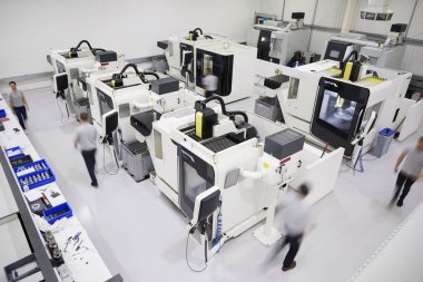 Overhead View Of Engineering Workshop With Workers Using CNC Machinery clipart