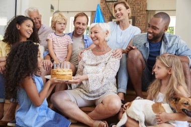 Family and friends celebrating grandmas birthday, clipart